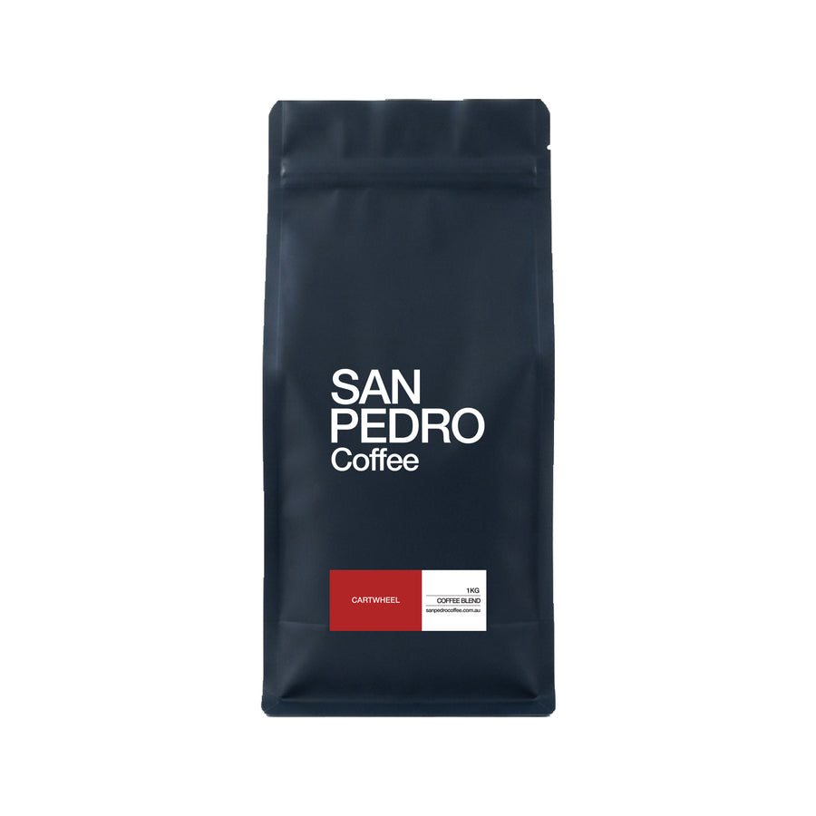 A dark navy blue stand-up coffee bag with white text reading 'SAN PEDRO Coffee' and a small red and white label near the bottom, shown on a plain white background.