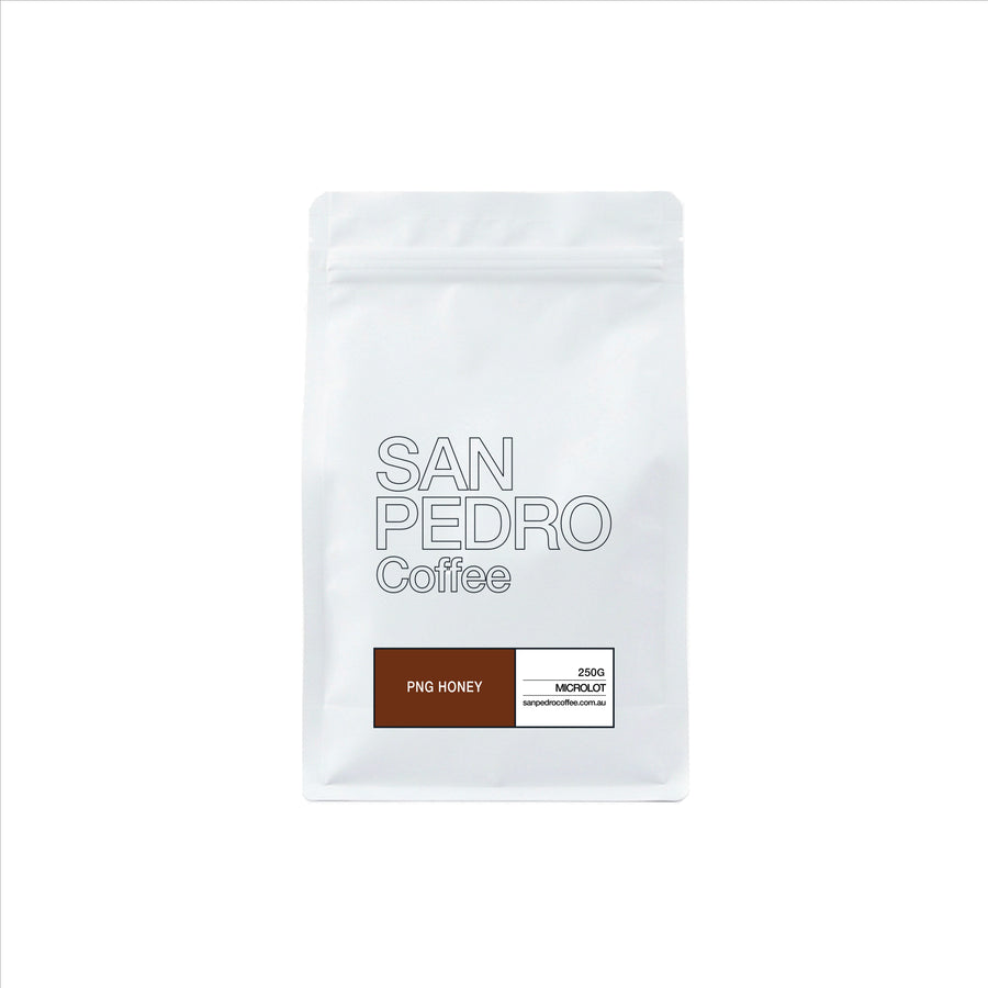 A white stand-up coffee bag with the text 'SAN PEDRO Coffee' and a label indicating 'INDIA' and 'MICROLOFT'.
