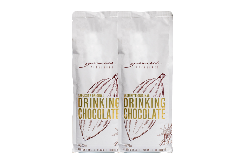 Two packages of grounded Drinking Chocolate on a white background